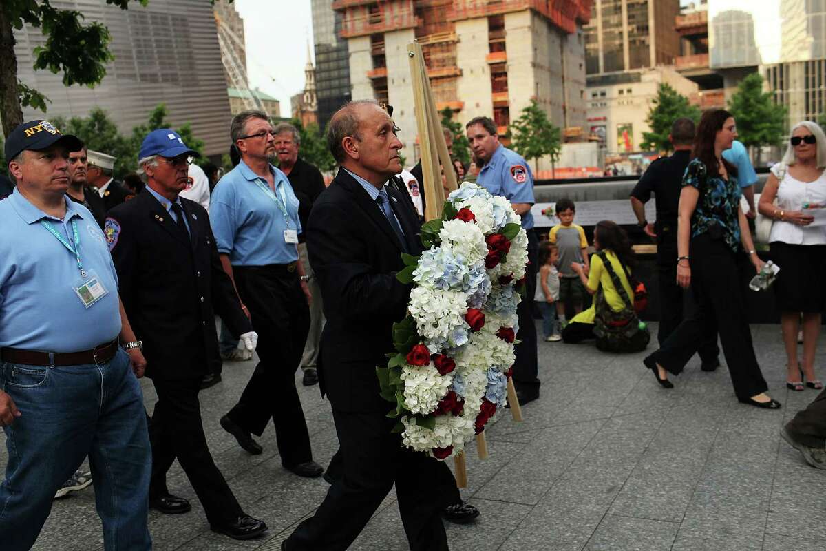 Lee Ielpi, who lost a son on September 11, 2001, prepares to lay a wreath during a tribute at the 9/11 Memorial for recovery workers and first responders on the10-year anniversary of the formal end of cleanup operations at Ground Zero on May 30, 2012 in New York City.