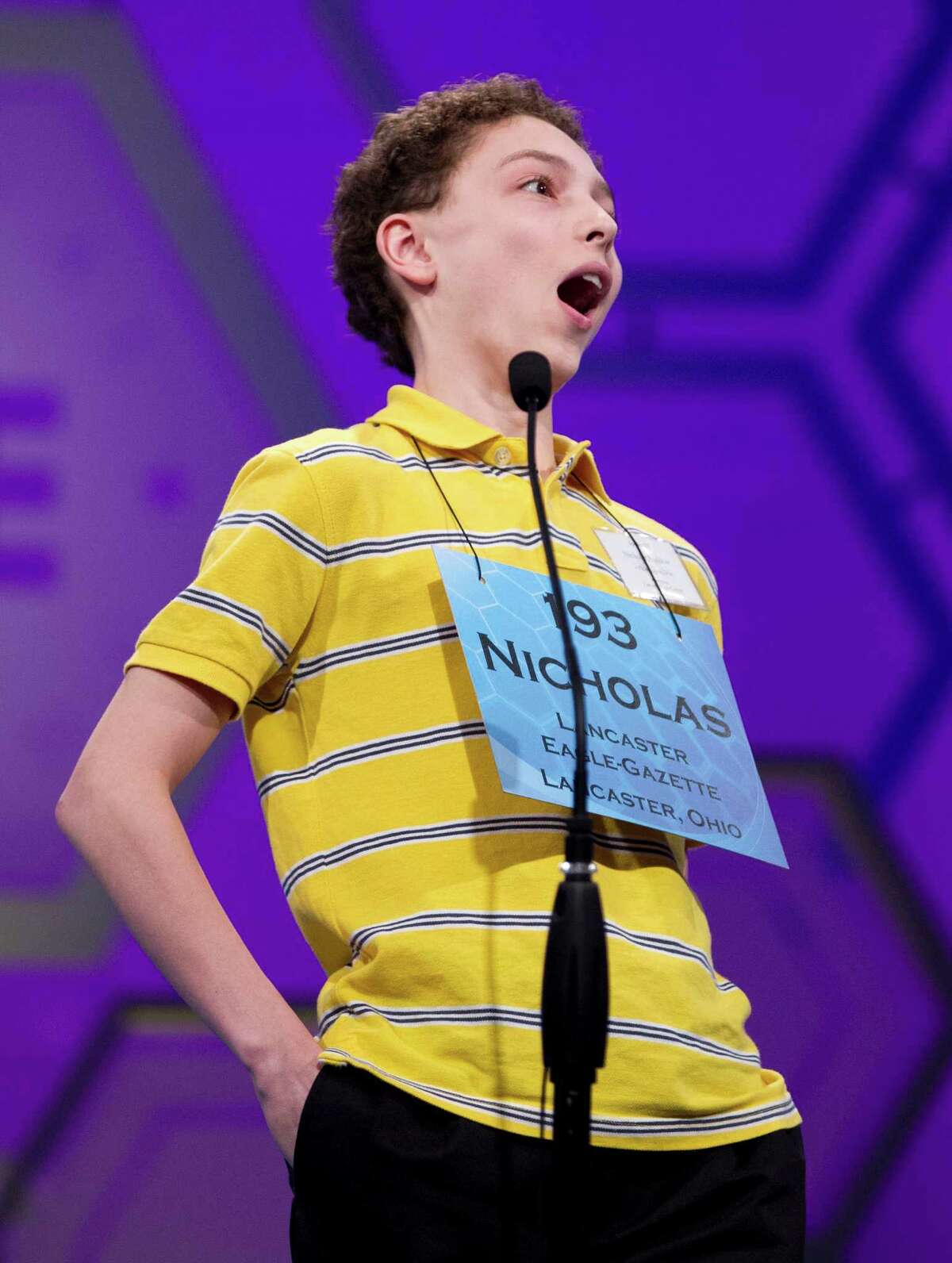 Nicholas Rushlow, 14, of Pickerington, Ohio, reacts to spelling the word "kanaima" correctly during the semifinal round of the National Spelling Bee, Thursday, May 31, 2012, in Oxon Hill, Md. (AP Photo/Evan Vucci)