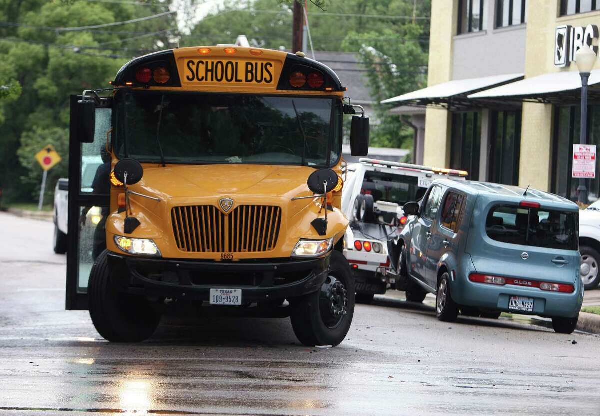 A Houston Independent School District school bus sits at the intersection of Montrose Boulevard and Sul Ross Street after an accident involving the bus and a Nissan Cube right, Thursday, May 31, 2012, in Houston. There were no reported injuries to the students or drivers of both vehicles.