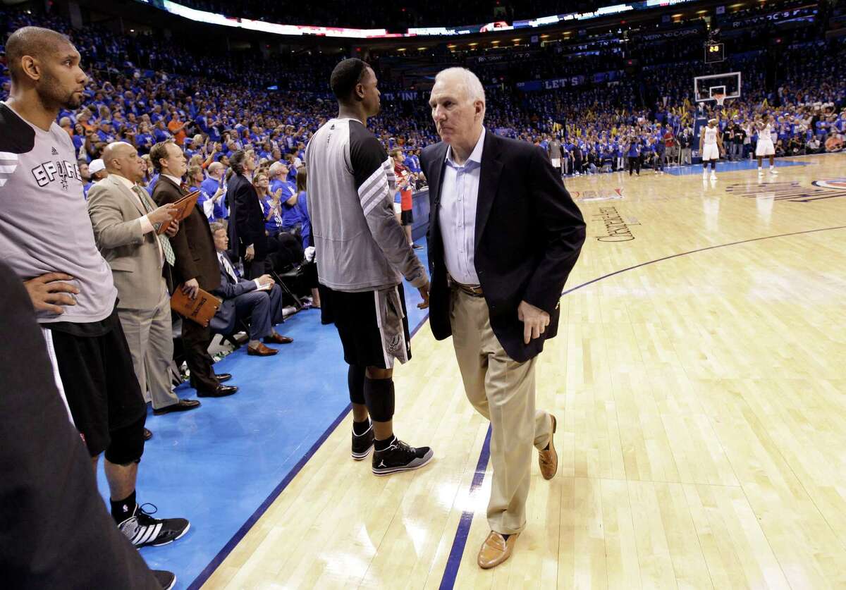 San Antonio Spurs head coach Gregg Popovich leaves at the end of Game 3 in their NBA basketball Western Conference finals playoff series against the Oklahoma City Thunder, Thursday, May 31, 2012, in Oklahoma City. The Thunder won 102-82. (AP Photo/Eric Gay)