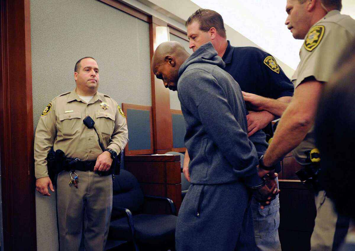 Boxer Floyd Mayweather Jr. is lead away in handcuffs at the Clark County Regional Justice Center as he surrenders to serve a three-month jail sentence at the Clark County Detention Center on June 1, 2012 in Las Vegas, Nevada. Mayweather pleaded guilty in December to attacking his ex-girlfriend while two of their children watched in September 2010.