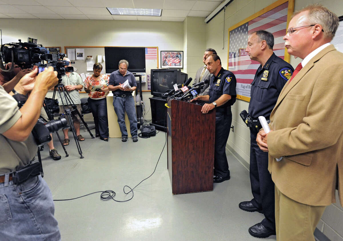 Police Chief John Tedesco speaks during a news conference at police headquarters Friday, June 1, 2012 in Troy, N.Y. City police officer Patrick Rosney, 53, of Rensselaer was arrested Friday morning by the New York Police Department on charges accusing him of committing computer crimes dangerous to minors. Also standing with him from left are Deputy Chief of Police Richard McAvoy, Assistant Chief of Police George VanBramer and Captain John Cooney. (Lori Van Buren / Times Union)