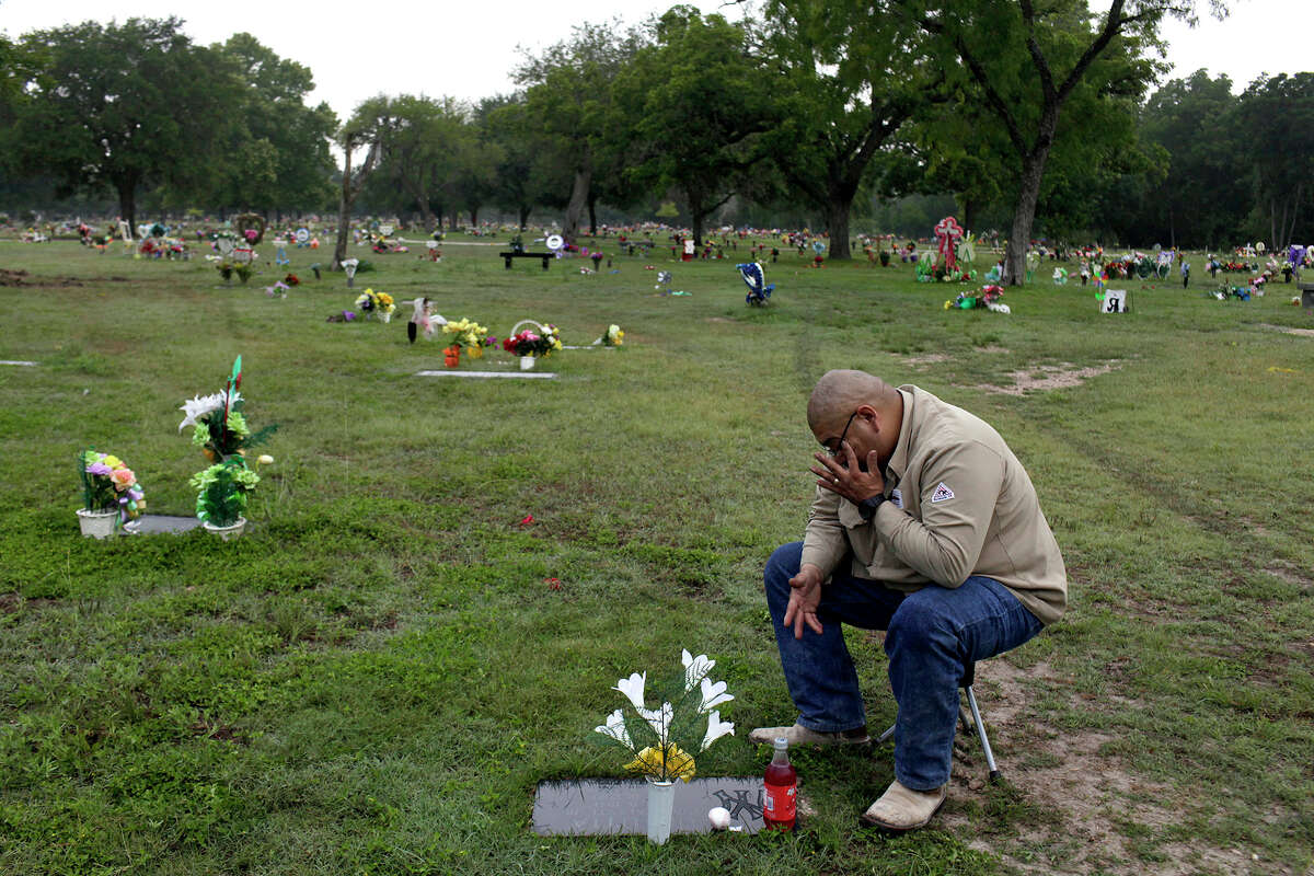John Garcez visits the grave of his brother-in-law and best friend, Juan Urrutia, who was killed when Jacob Perez, who was drunk and driving the wrong way on U.S. 90, hit their car, which Garcez was driving and Urrutia was a passenger in, in San Antonio on May 19, 2012. Garcez visits Urrutia's grave at least once a week, bringing Urrutia's favorite drink, Big Red, and a baseball or football, for their shared love of sports.