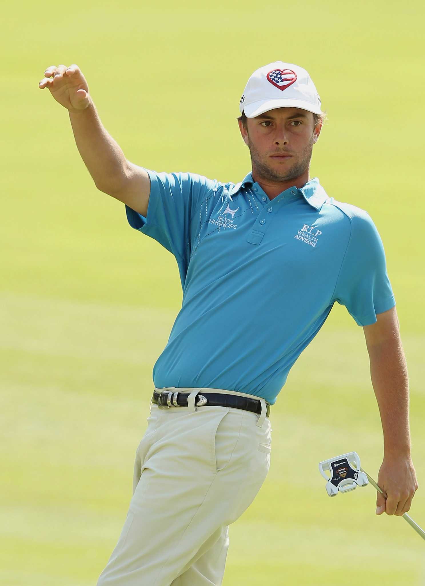 Golf Levin battles wind to lead Memorial