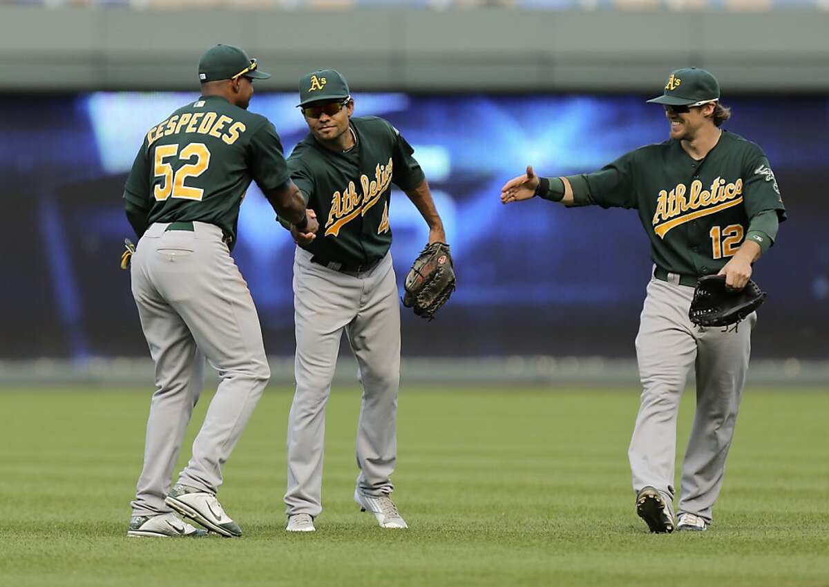 A's pound Royals to end losing streak