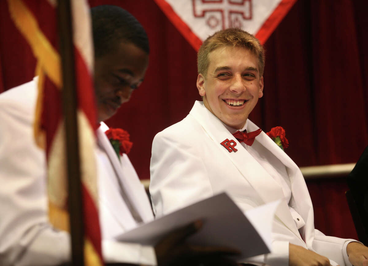 Fairfield Prep Senior Class president Patrick Barthelmy, left, and Senior Speaker Robert Salandra chat on the stage during the 70th Commencement Exercises at Fairfield University's Alumni Hall in Fairfield on Sunday, June 3, 2012.