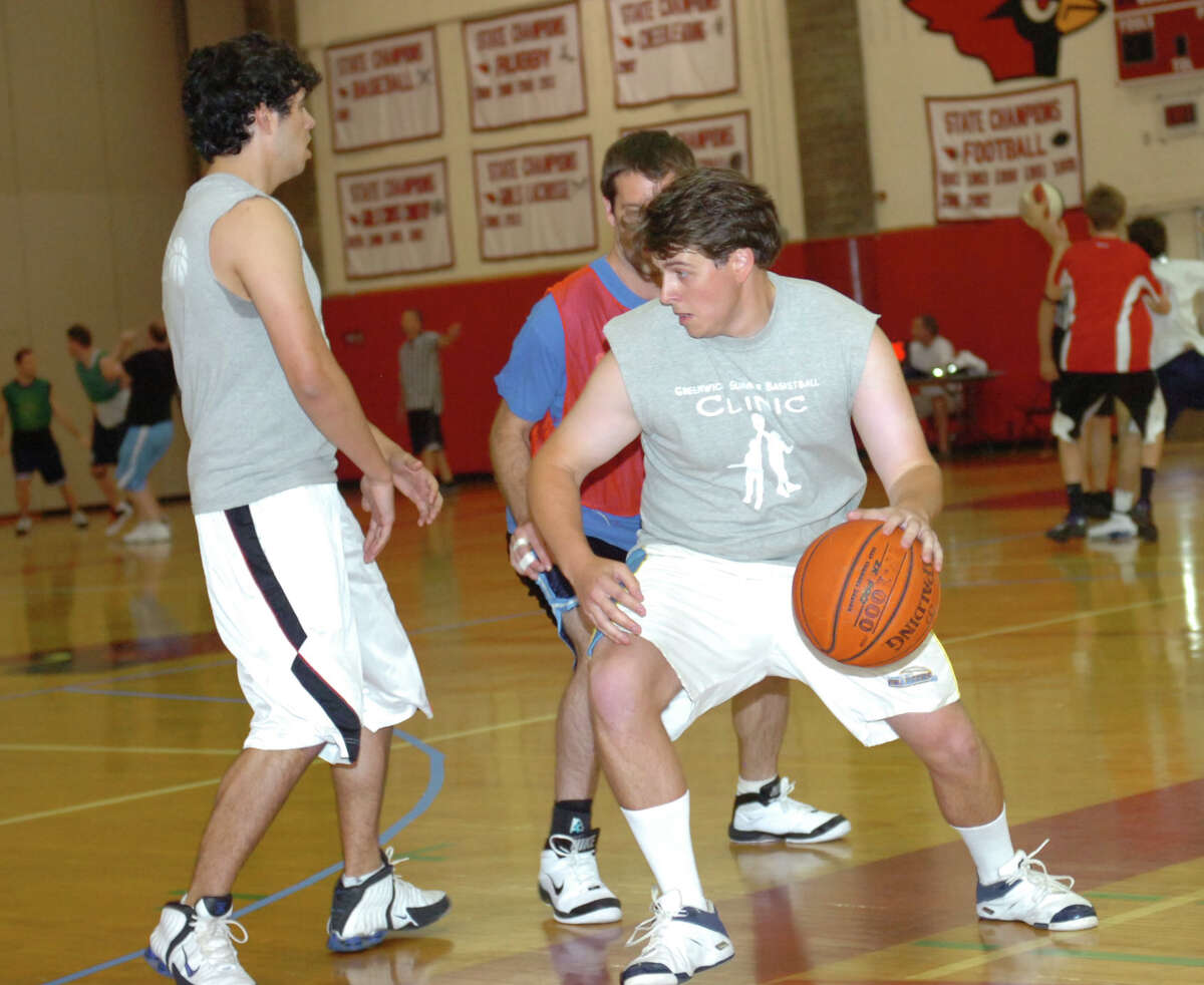 From left: Andrew Gruseke, Mike D'Auria and Matt Gruseke at the 3-on-3 tournament at the first Coach Bob Classic, to honor the legacy of Bob Haugen, the founder and former president of the Greenwich Basketball Association at Greenwich High School Sunday, June 3, 2012.