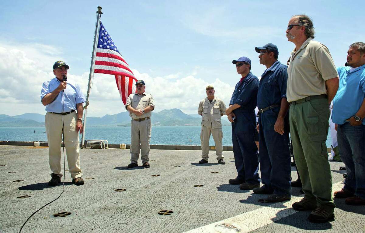 U.S. Secretary of Defense Leon Panetta, left, speaks to members of the crew as he visits USNS Richard E. Byrd in Cam Ranh Bay, Vietnam, June 3, 2012. Panetta toured the former U.S. air and naval base in the bay, becoming the most senior American official to go there since the war ended. (AP Photo/Jim Watson, Pool)