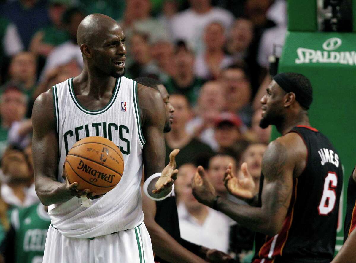 Boston Celtics forward Kevin Garnett, left, and Miami Heat forward LeBron James (6) react during the fourth quarter of Game 4 in their NBA basketball Eastern Conference finals playoff series in Boston Sunday, June 3, 2012. Boston won 93-91 in overtime to even the series at two games each. (AP Photo/Elise Amendola)