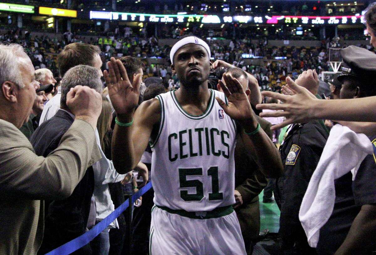Boston Celtics guard Keyon Dooling (51) is congratulated by fans after beating the Miami Heat 93-91in Game 4 in their NBA basketball Eastern Conference finals playoff series in Boston Sunday, June 3, 2012. (AP Photo/Elise Amendola)