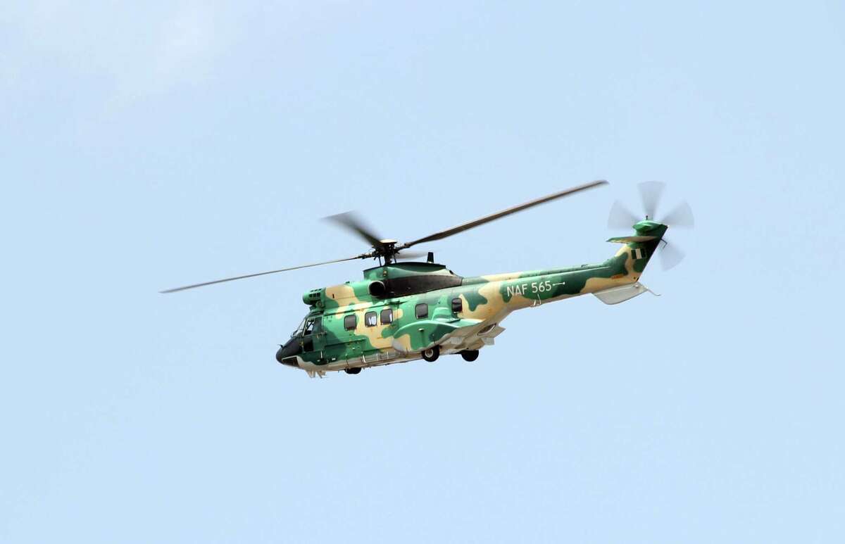 A surveillance helicopter hovers above the scene of the crashed Dana Airline flight in the densely populated Toyin Area of Iju Ishaga in Lagos, on June 4, 2012. The flight that crashed in Nigeria's largest city of Lagos, killing all of the 153 people on board, reported both of its engines having failed before it went down, the civil aviation chief said. AFP PHOTO / AREWA EMMANUELAREWA EMMANUEL/AFP/GettyImages