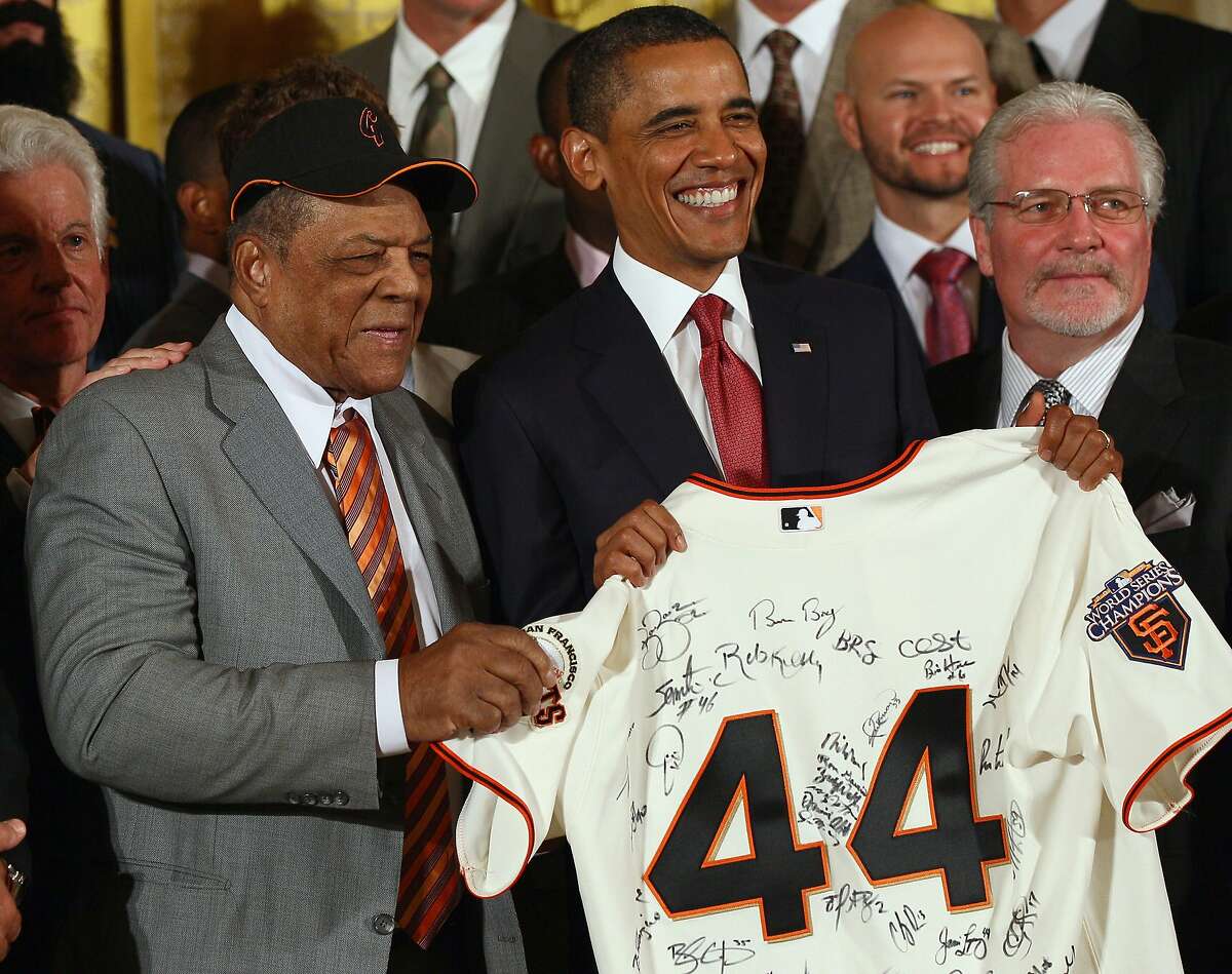 WASHINGTON, DC - JULY 25: U.S. President Barack Obama (C) receives a jersey from Hall of Fame player Willie Mays (L) and San Francisco Giants General Manager Brian Sabean (R) during an event with the World Series champions in the East Room of the White House July 25, 2011 in Washington, DC. The Giants defeated the Texas Rangers in the 2010 World Series, giving the franchise their first World Series championship since 1954, and the first since relocating to San Francisco in 1958.