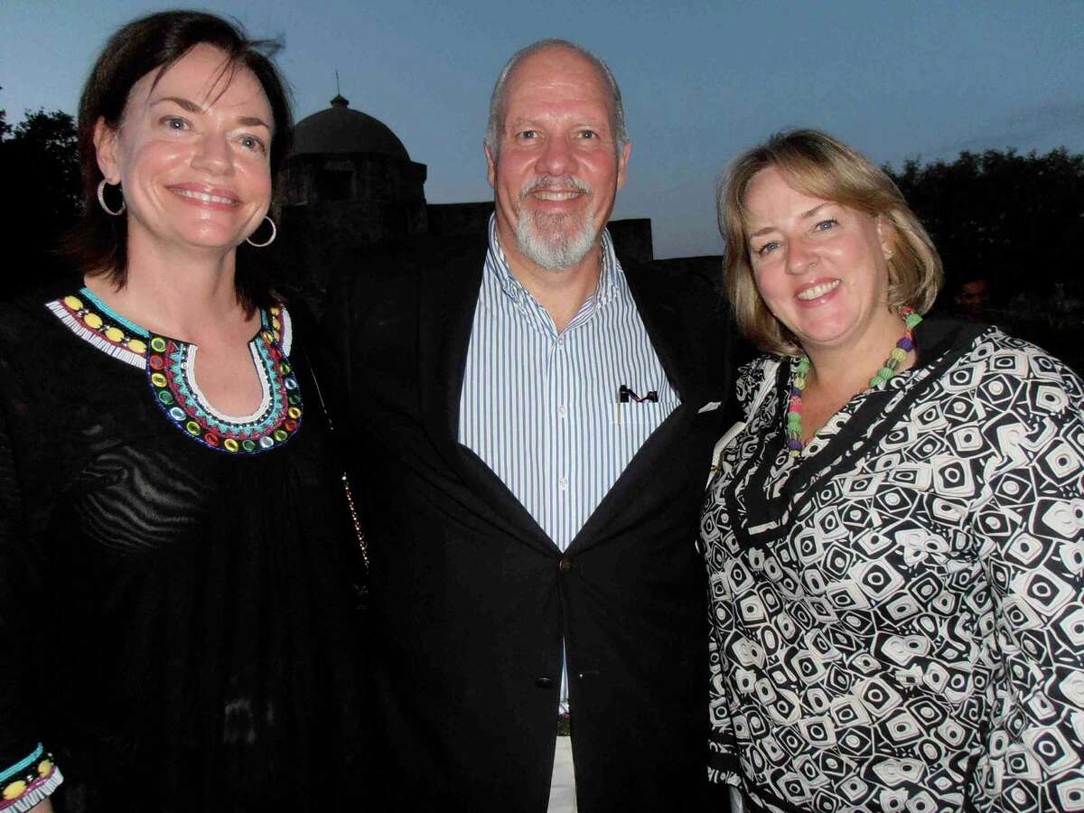 Ruth Agather, from left, her husband, John Agather, and Katie Luber enjoy a spectacular sunset at a dinner celebrating the 40th anniversary of UNESCO's World Heritage Conventions. The dinner was part of the convention, held in San Antonio.