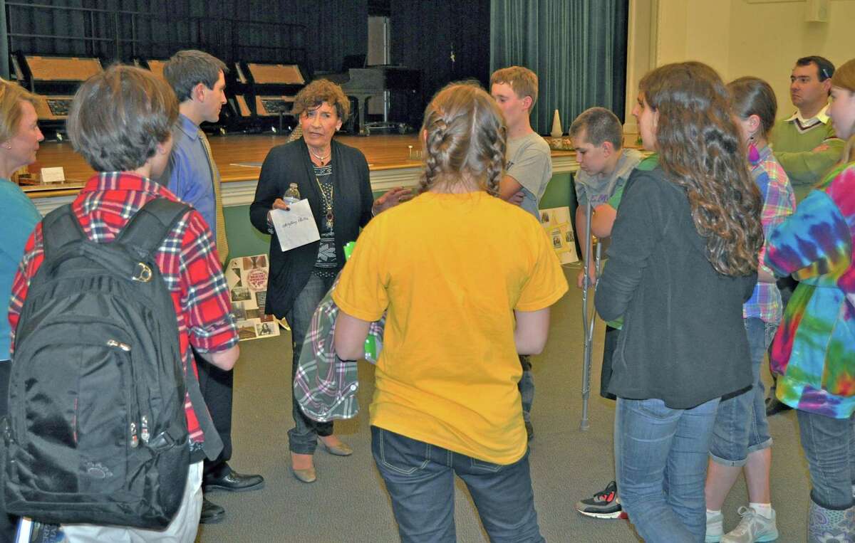 Anita Schorr talks with Middlesex Middle School seventh grade students in Darien, Conn.