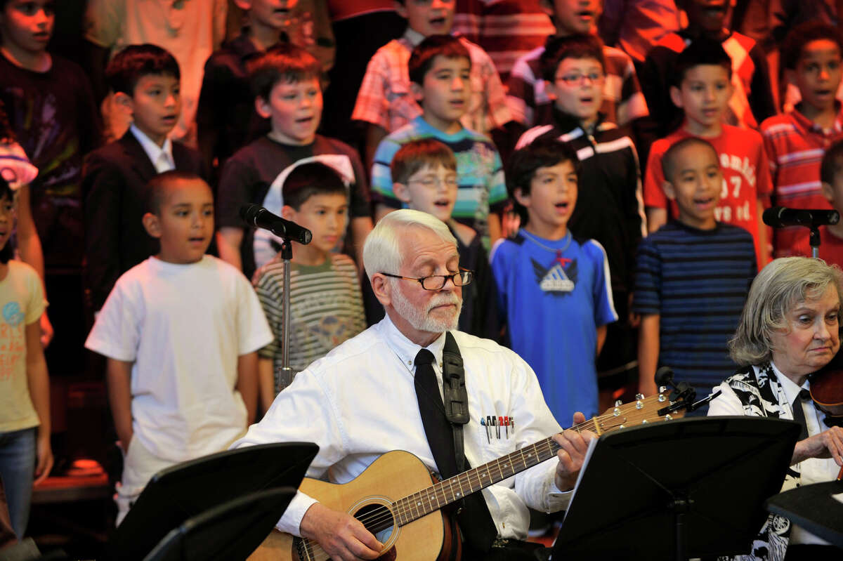 Barry Finch plays guitar during a musical concert combining the Senior Melodiers from Founder's Hall in Ridgefield and third-graders at Ellsworth Avenue School in Danbury, Conn., on Wednesday, June 6, 2012.