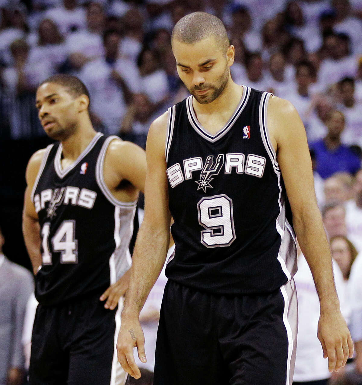 San Antonio Spurs point guard Tony Parker (9), of France, and guard Gary Neal (14) head to the sideline against the Oklahoma City Thunder during the second half of Game 6 in the NBA basketball Western Conference finals, Wednesday, June 6, 2012, in Oklahoma City. (AP Photo/Eric Gay)