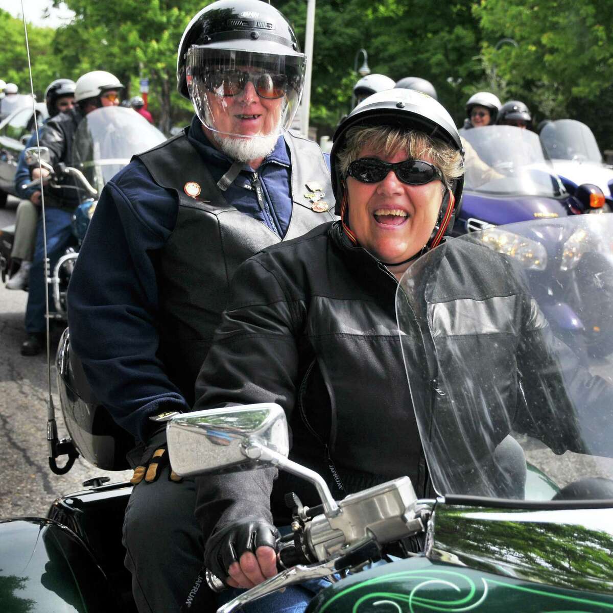 Darrel Palmer,left, rides passenger on his daughter's, Kathy Paradise's, Valkyrie motorcycle as they cruise along Canada Street during Americade weekend in Lake George Friday morning June 5, 2009.