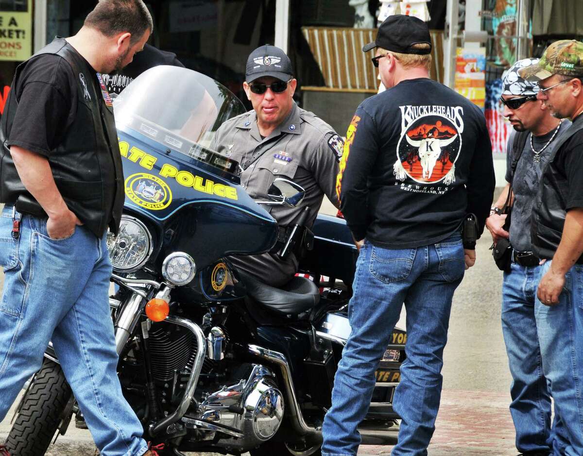 Even in a town filled with custom choppers and high tech cafe racers, NYS Trooper Art Pittman's Harley Davidson Police Special draws onlookers along Canada Street during Americade weekend in Lake George Friday morning June 5, 2009.