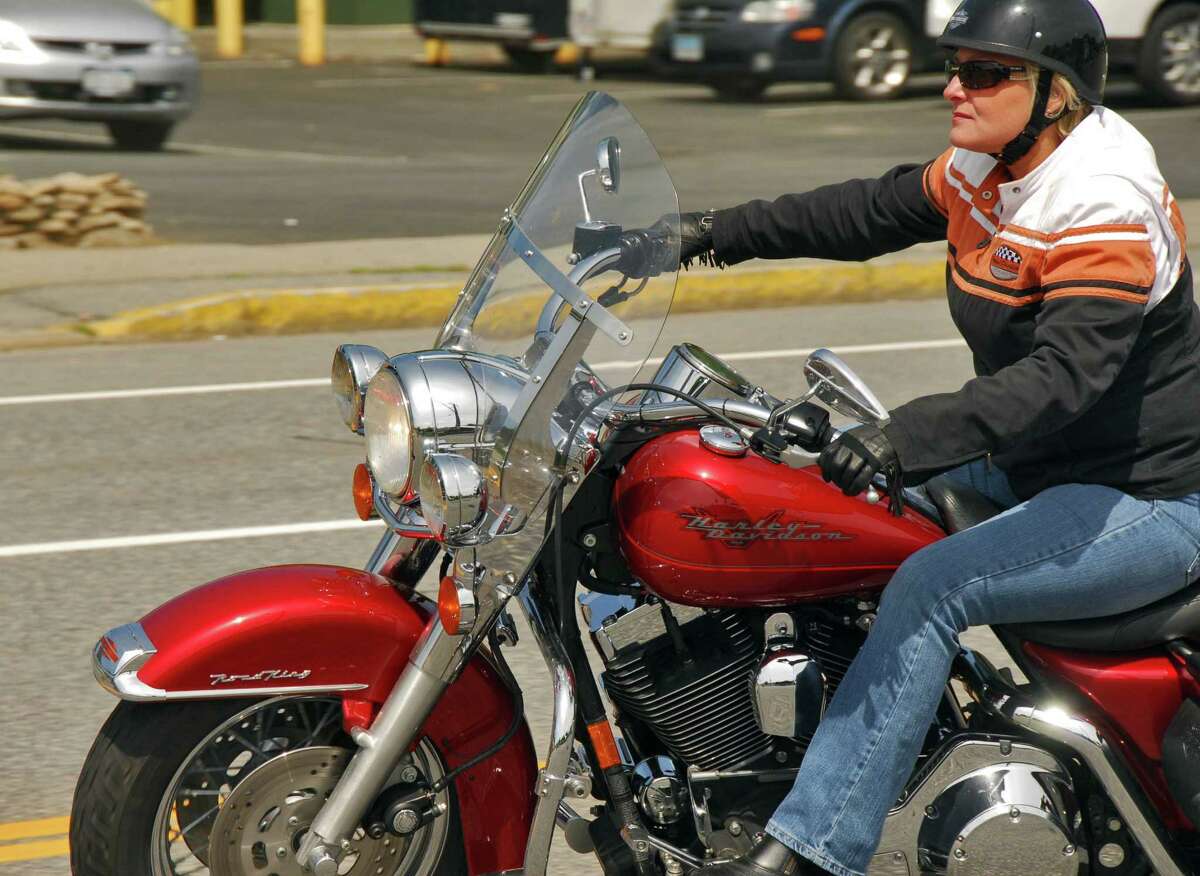 Jo-Anne Hodges of St. Zotiqu, Quebec rides her 1450cc Harley Road King along Canada Street in Lake George Village, Thursday during the 25th annual Americade Rally morning June 7, 2007. Hodges has been riding for 12 years and this is her 6 time at Americade. 