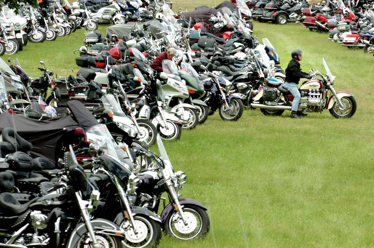 A motorcyclists makes his way through the sea of parked bikes during Americade 2007 on Wednesday, June 6, 2007, in Lake George, N.Y. 