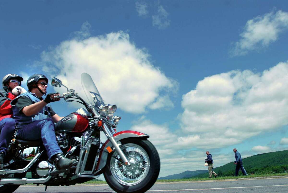 Motorcyclists cruise the shoreline of Lake George during Americade 2007 on Wednesday, June 6, 2007, in Lake George, N.Y.