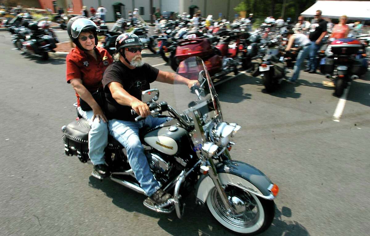 Greg and Nona Lavorgna of Roscoe, N.Y. ride their Harley Davidson into a demo area during Americade on Thursday, June 9, 2005, in Lake George Village, N.Y.