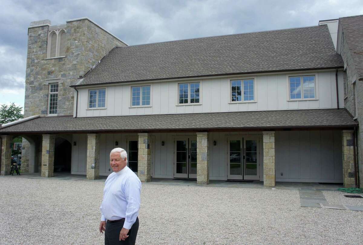 The Rev. John Branson stands in front of Christ & Holy Trinity Episcopal Church's Great Hall, a 3,000-square-foot addition to the church that opened in 2011. Thursday, June 7, 2012/ Westport, CT