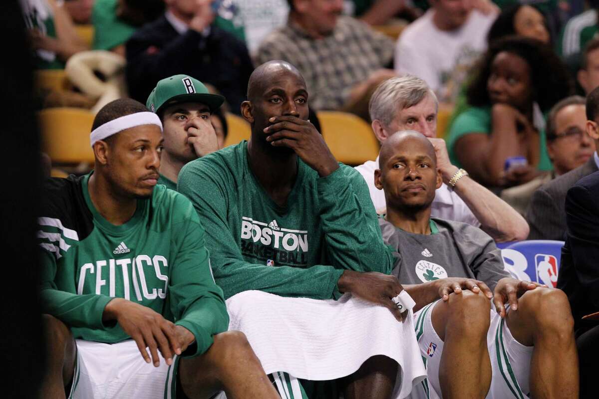 Boston Celtics' Paul Pierce, left, Kevin Garnett, center, and Ray Allen, right, sit on the bench near the end of the fourth quarter of Game 6 against the Miami Heat in their NBA basketball Eastern Conference finals playoff series in Boston Thursday, June 7, 2012. Boston won 98-79. (AP Photo/Elise Amendola)