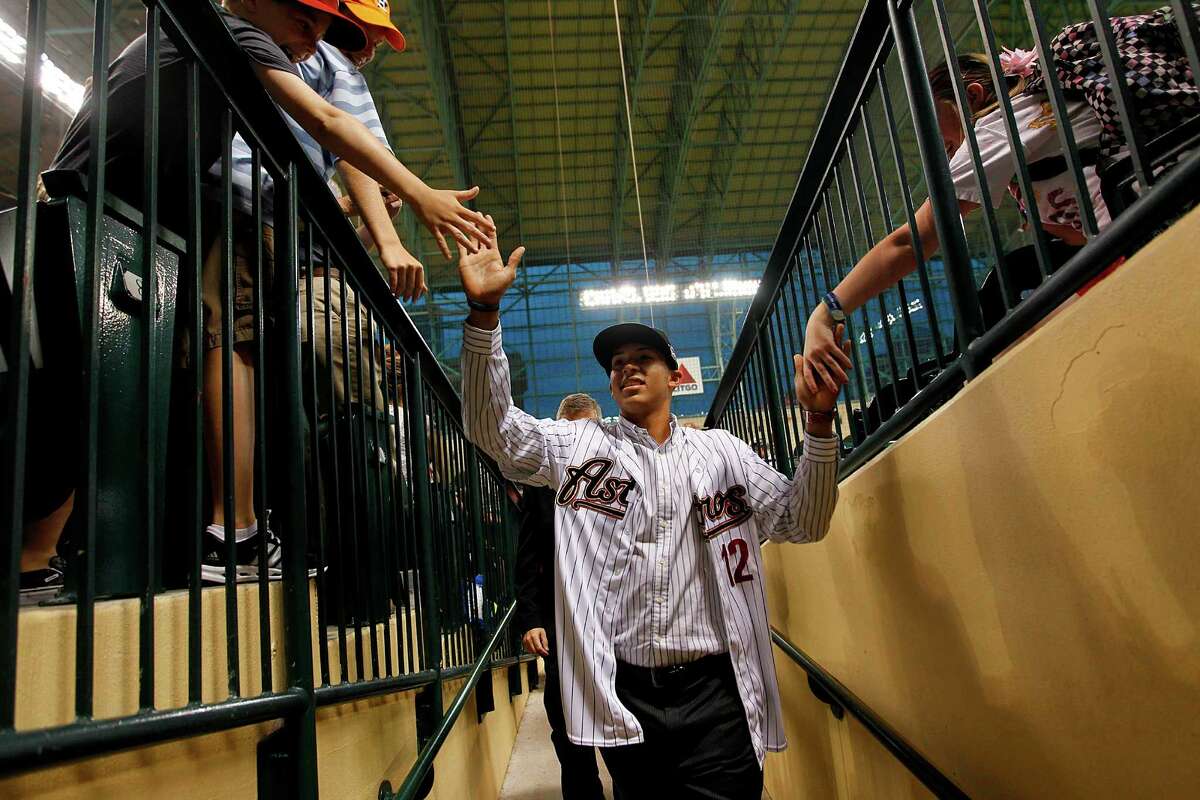 PHOTOS: The Astros' best and worst first-round draft picks Carlos Correa high-fives fans as he walks into the tunnel on Thursday, June 7, 2012, in Houston after signing as the No. 1 overall pick. It looks like Correa will go down as one of the franchise's best first-round draft picks. Browse through the photos above for a look at the best and worst first-round draft picks in Astros franchise history.