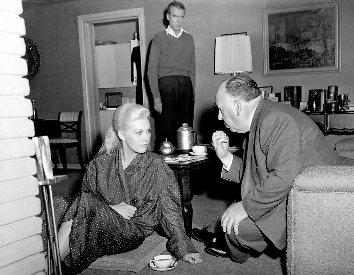 PHoto credit San Francisco Museum and Historical Society. Kim Novak getting direction from Alfred Hitchcock for Vertigo. James Stewart is in the background