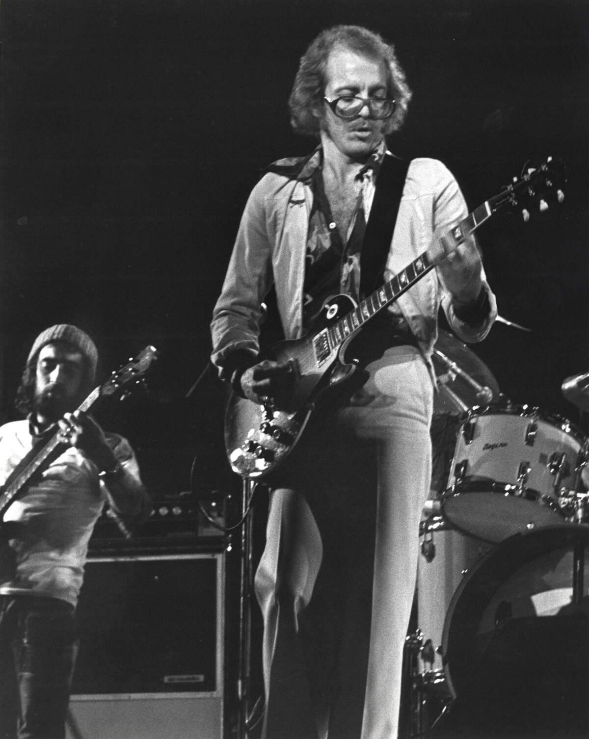 Bob Welch (right), lead guitar, and John McVie, bass, for Fleetwood Mac, perform with the band at Tarrant County Convention Center in Fort Worth in late 1974.
