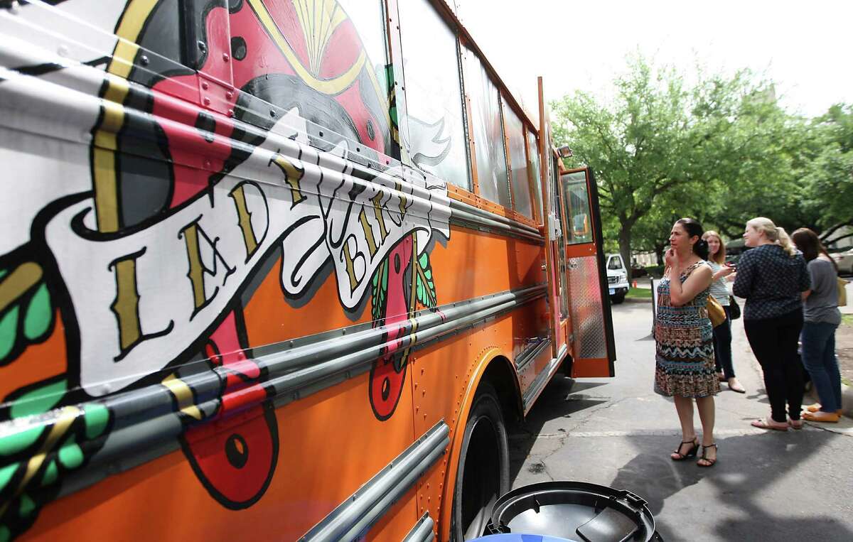 People line up for lunch at the Lady Bird food truck in Houston.