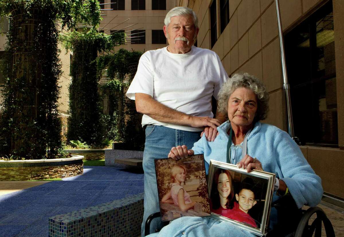 Charlie Wright and his wife, Norma, hold photos of their deceased daughter and granddaughter. Both women - the mother, Tammy Wright, and the daughter, Jennifer McKinley - died violently, 27 years apart.