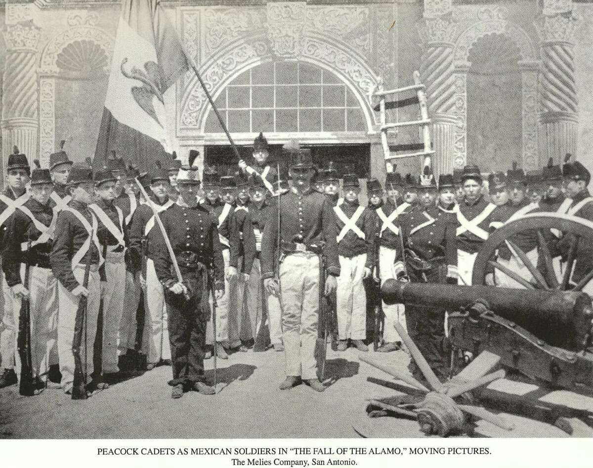 A still from “The Immortal Alamo,” a lost film made by Gaston Melies with Peacock Military Academy cadets playing Mexican Army soldiers. The 'Alamo" behind them is a painted backdrop.