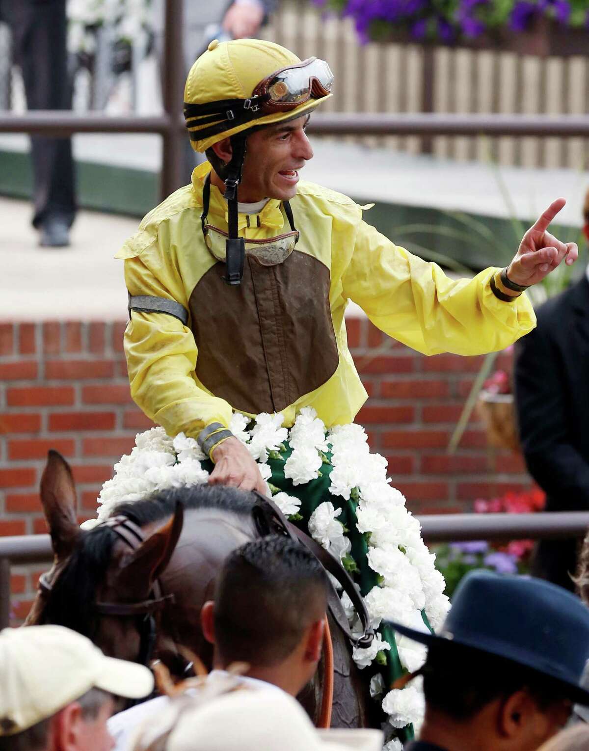 Jockey John Velazquez smiles aboard Union Rags after their win in the Belmont Stakes horse race at Belmont Park in Elmont, N.Y., on Saturday, June 9, 2012. (AP Photo/Mike Groll)