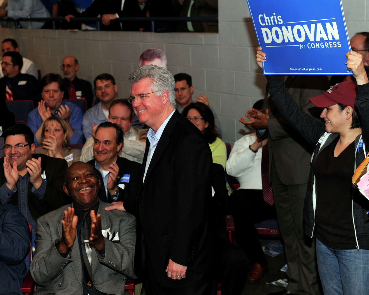 House Speaker Chris Donovan, center, listens as delegates cast their votes for the Democratic convention for the 5th congressional district Monday in Waterbury, May 14, 2012.