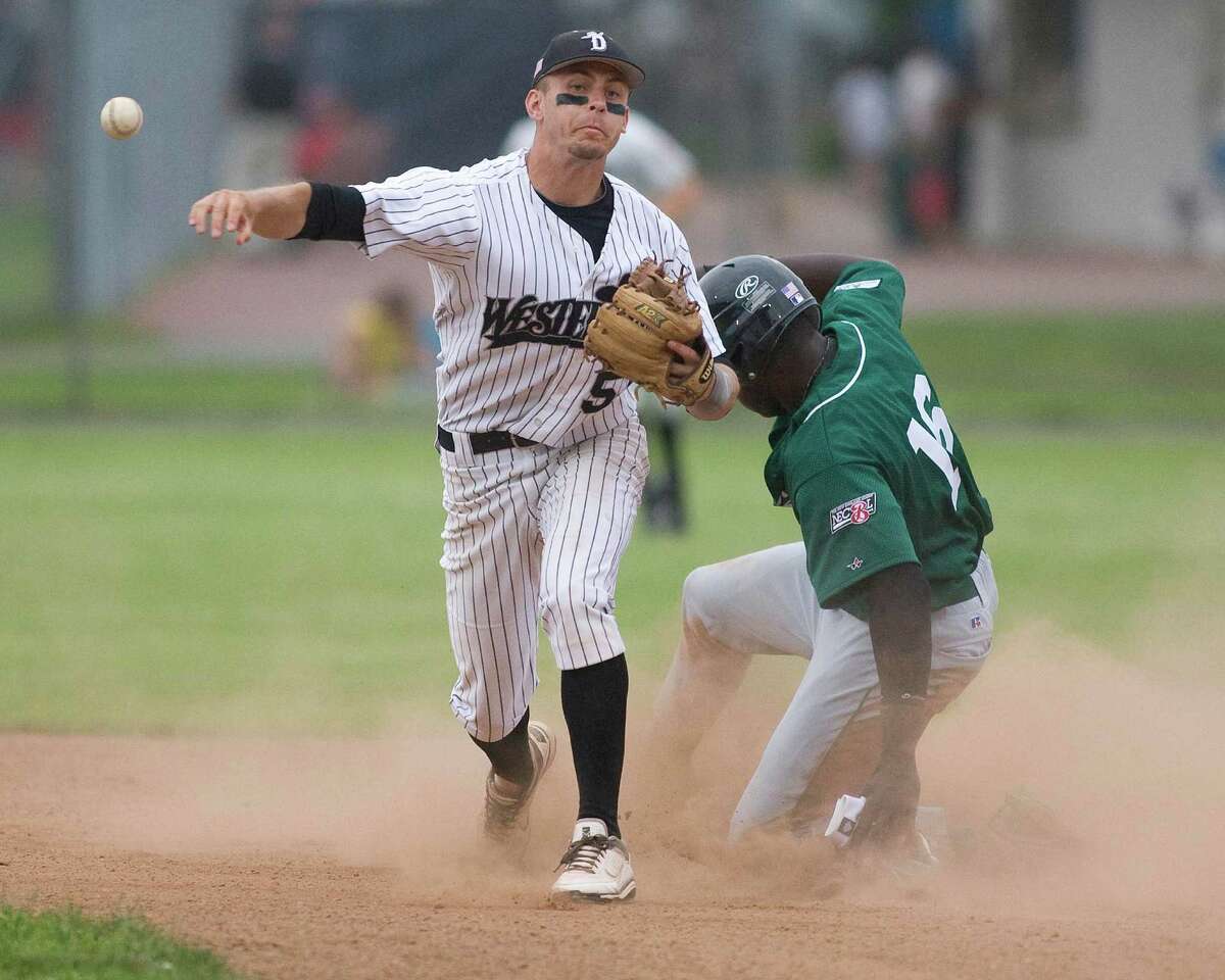 Westerner shortstop Zach Shank forces Vermont's Michael White at second but is unable to complete the double play Monday night at Rogers Park.