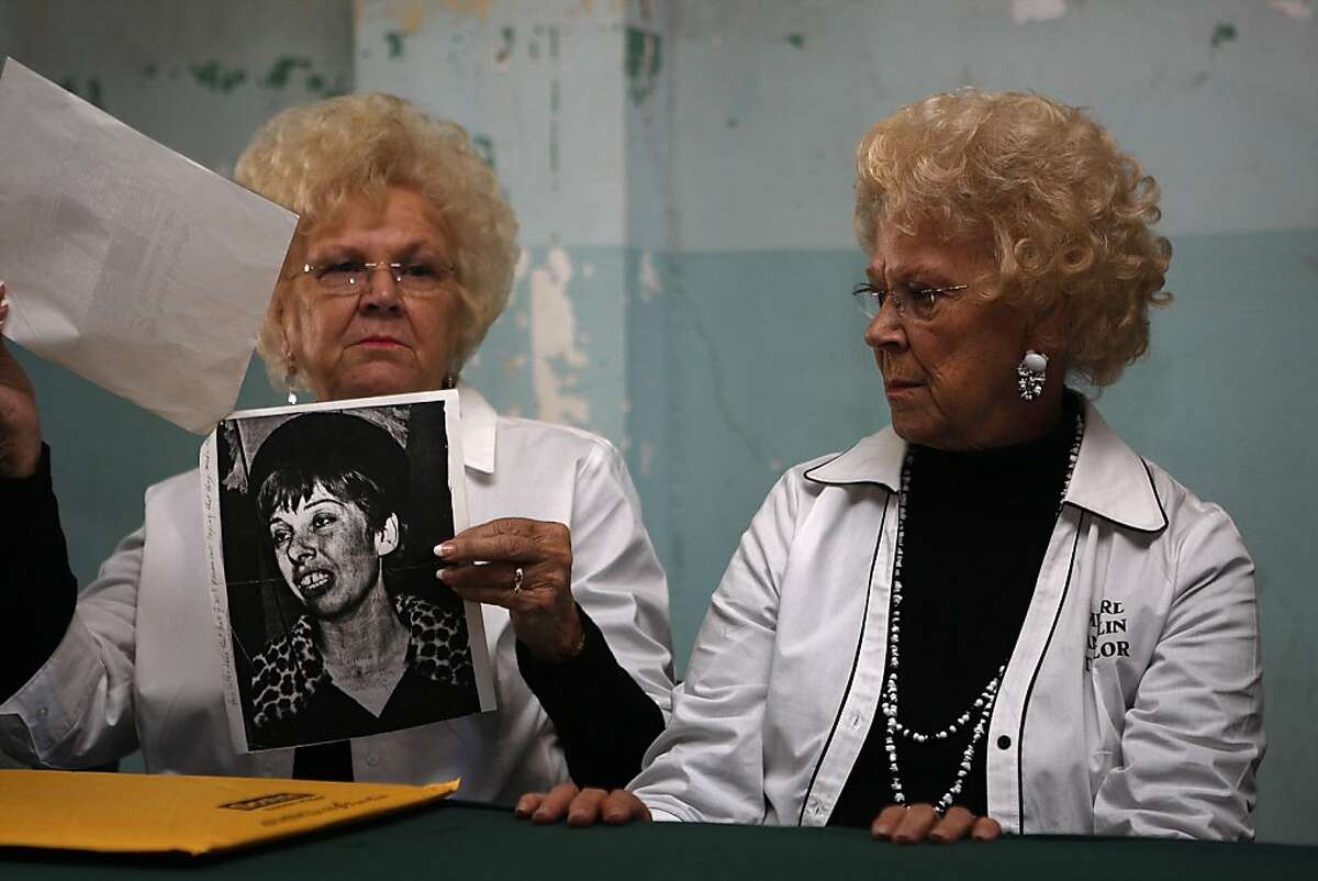 Sisters of the Anglin brothers, Marie Anglin Widner (left) and Mearl AnglinTaylor (right) show an article where a woman, Eugenia MacGowan received a call alleging that the Anglin brothers had survived the escape during their visit to Alcatraz on the 50th anniversary of the Anglin Brothers escape in San Francisco, California, on Monday, June 11, 2012.