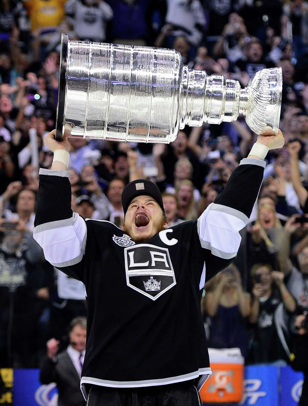 Kings 6, Devils 1 American star and Los Angeles Kings captain Dustin Brown is the first to get the Cup.(AP Photo/Mark J. Terrill)