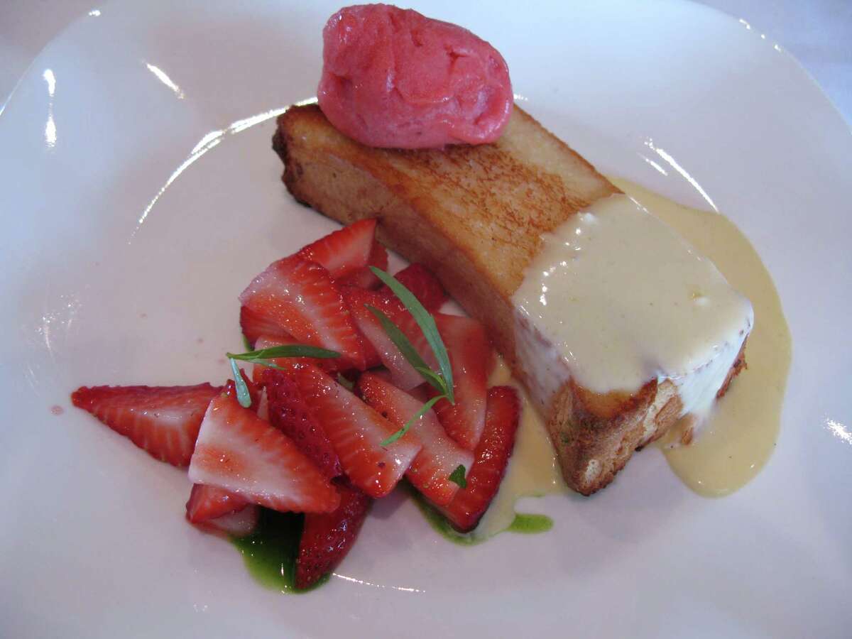 Angel food cake is pan-fried and served with Anglaise, local strawberry sorbet and fresh strawberries.