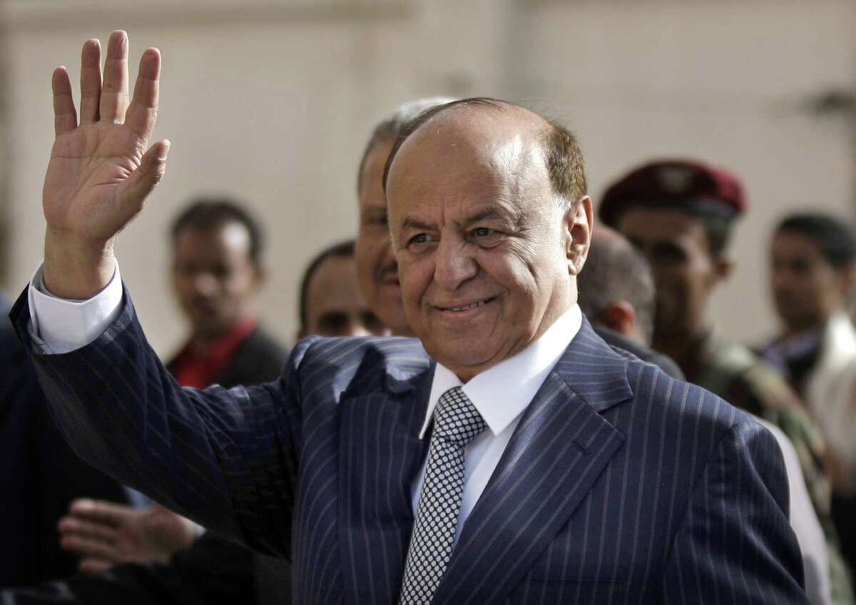FILE - In this Tuesday, Feb. 21, 2012 file photo,Yemen's Vice President Abed Rabbo Mansour Hadi gestures as he enters a polling center to cast his vote in Sanaa, Yemen. Yemeni troops and armed tribesmen drove al-Qaida militants from two southern strongholds on Tuesday, a major victory in a U.S.-backed offensive to seize territory held for more than a year by the terror network as it exploited political turmoil to gain a foothold in the strategic area. The victories capped weeks of fighting as Yemen's new President Abed Rabbo Mansour Hadi has pledged to uproot al-Qaida from the south with help from the United States as part of a new cooperation following Saleh's ouster. (AP Photo/Hani Mohammed, File)