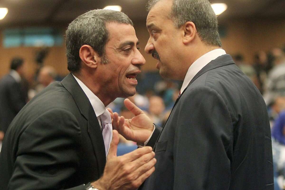 Egyptian parliament members Mustafa al-Gendi (L) and Muslim Brotherhood member Mohammed el-Beltagi have a heated discussion during a meeting to elected the members for the Constitution Committee in Cairo on June 12, 2012. AFP PHOTO / KHALED DESOUKIKHALED DESOUKI/AFP/GettyImages