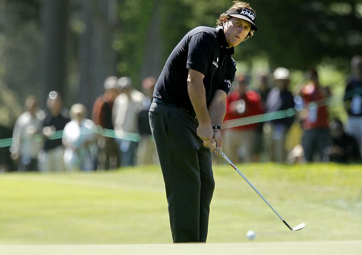 Phil Mickelson chips to the par-3 seventh hole, as the second day of practice rounds continue during the United States Open Championship at the Olympic Club in San Francisco, Ca., on Tuesday June 12, 2012.