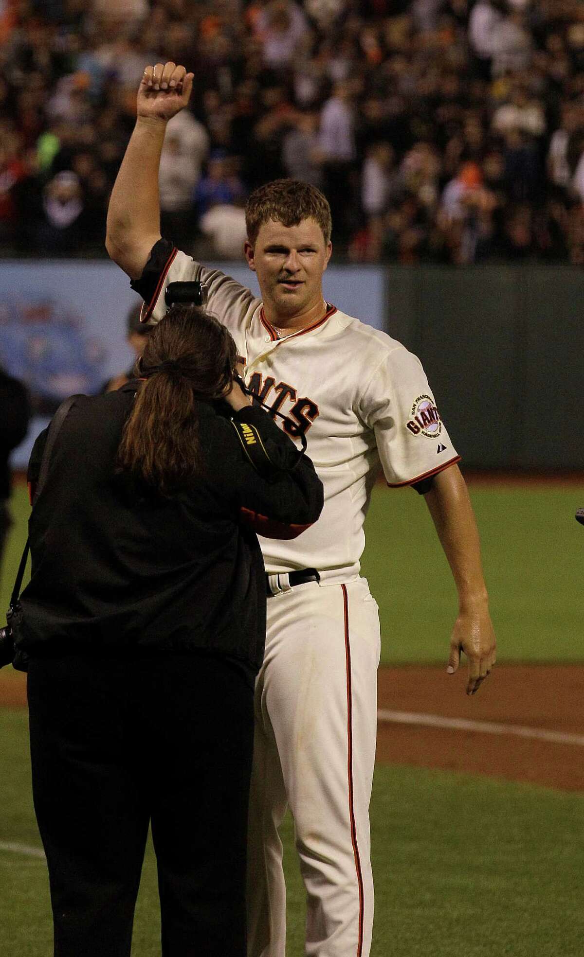 San Francisco Giants pitcher Matt Cain celebrates after the final out of the ninth inning of a baseball game against the Houston Astros in San Francisco, Wednesday, June 13, 2012. Cain pitched a perfect game. The Giants won 10-0. (AP Photo/Jeff Chiu)