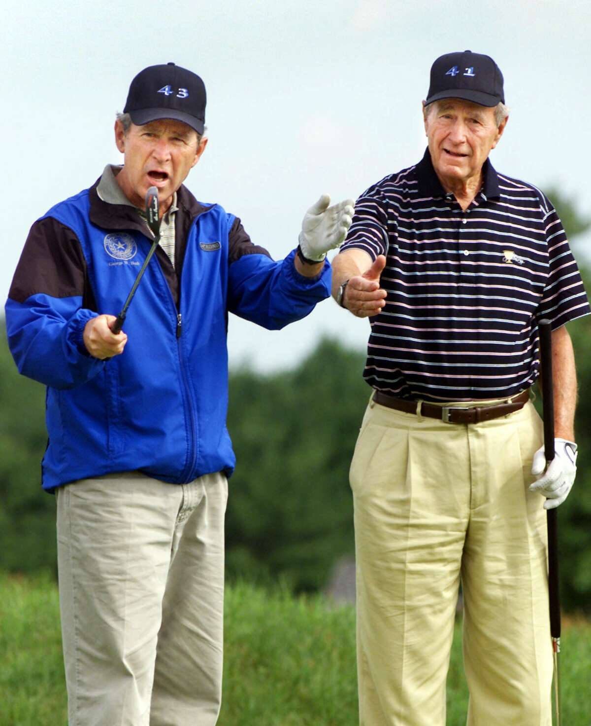A reader accuses a New York Times columnist of turning a paean to former President George H.W. Bush (right) into an attack against his son, former President George W. Bush, both shown celebrating the 55th birthday of the younger Bush in 2001.