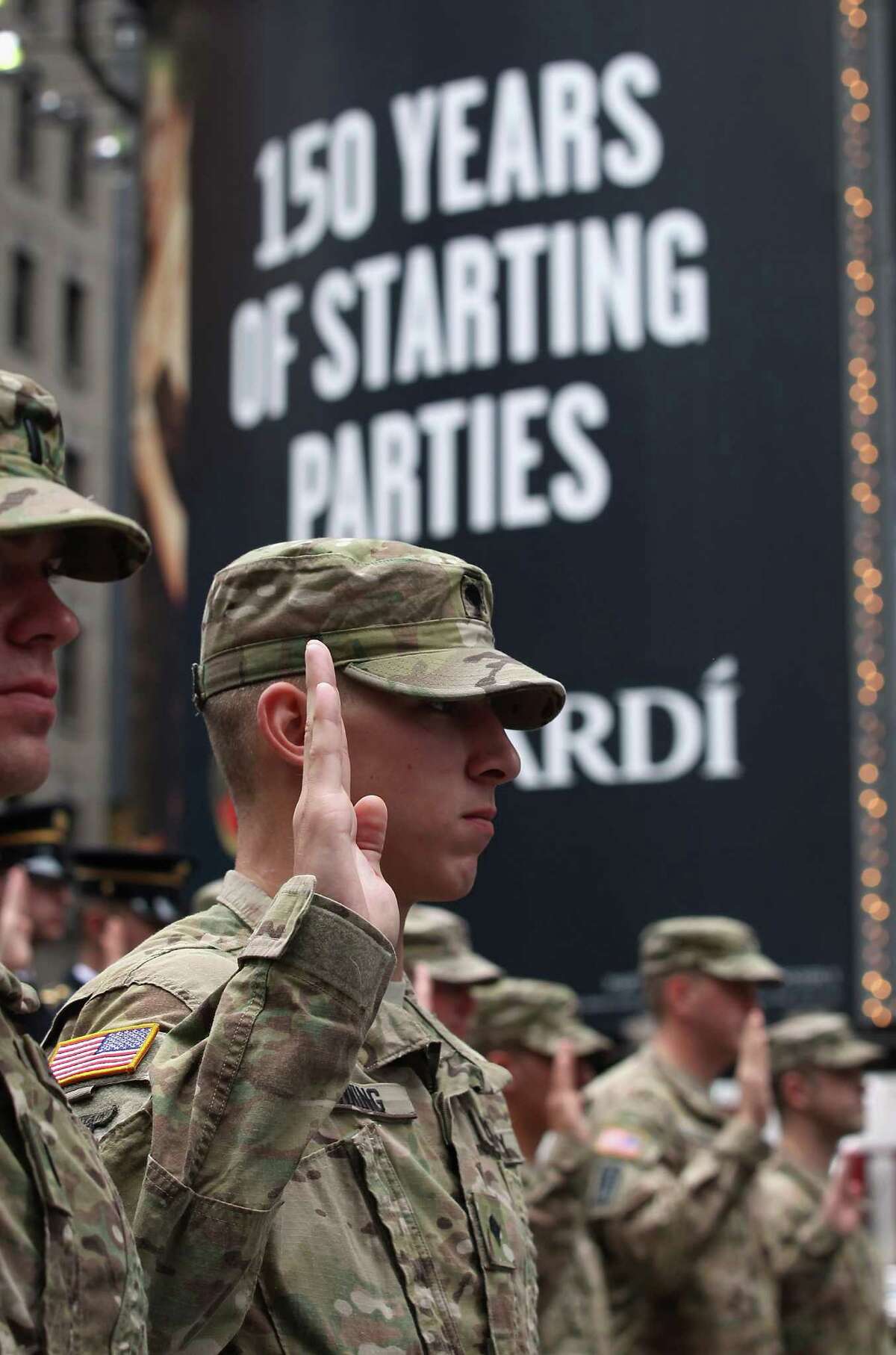 U.S. Army soldiers repeat an oath of allegience as U.S. Army Chief of Staff Gen. Raymond Odierno swears in new recruits on June 14, 2012 in Times Square in New York City. Odierno, fellow Army troops and New York dignitaries marked the 237th anniversary of the U.S. Army at the event.