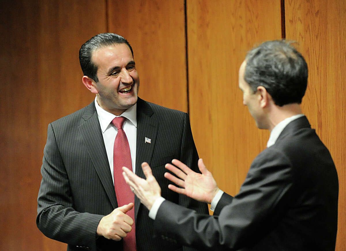 Peter Lumaj, left, speaks with Jim Campbell, chairman of the Greenwich Republican Town Committee, during an RTC meeting at Greenwich Town Hall, Feb. 22, 2012. Lumaj has dropped out of the U.S. Senate race.