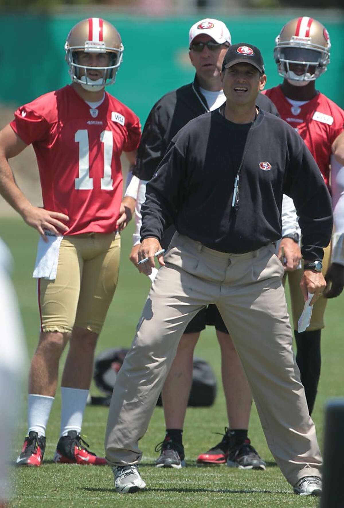 Head coach Jim Harbaugh watches a play during practice at the 49ers facility in Santa Clara, Calif. on Thursday, June 14, 2012.