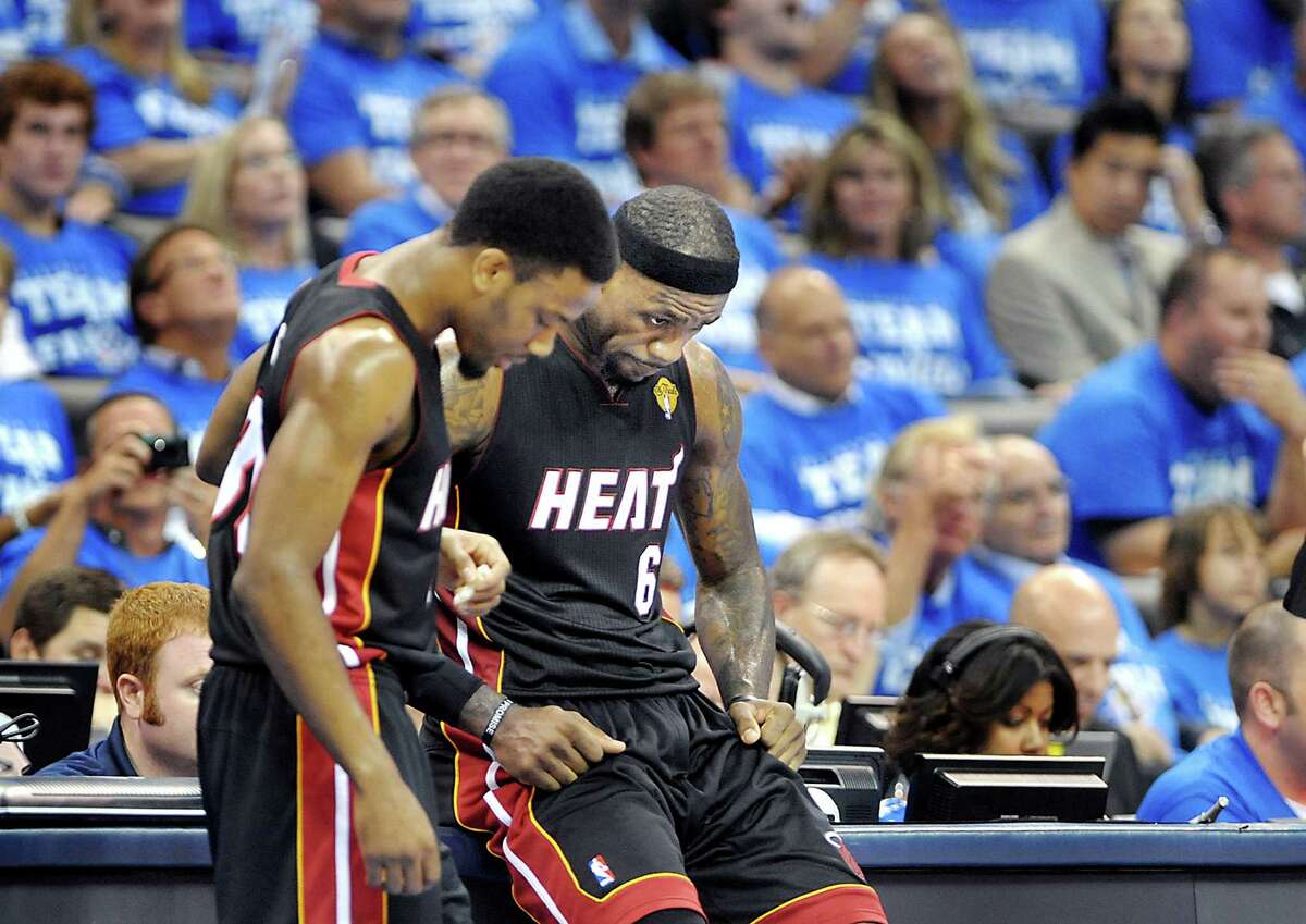 The Miami Heat's Norris Cole, left, and LeBron James take a breather during a timeout in Game 2 of the NBA Finals against the Oklahoma City Thunder on Thursday, June 14, 2012, at Chesapeake Energy Arena in Oklahoma City, Oklahoma. (Robert Duyos/Sun Sentinel/MCT)