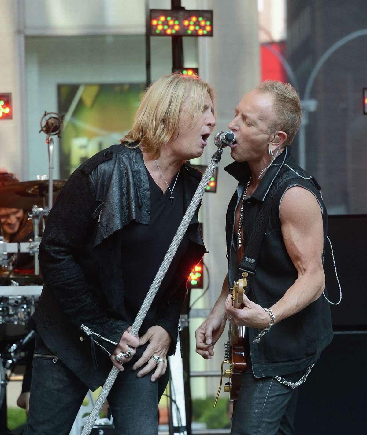 Joe Elliott and Phill Collen of Def Leppard perform during "FOX & Friends" All American Concert Series at FOX Studios on June 15, 2012 in New York City.